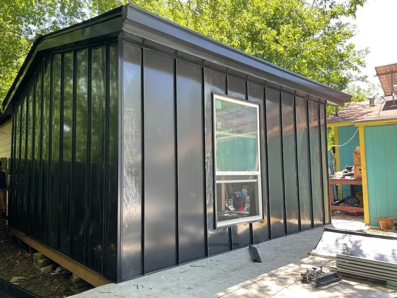 Black standing seam metal wall panels for Metal Roof Installation in Brighton